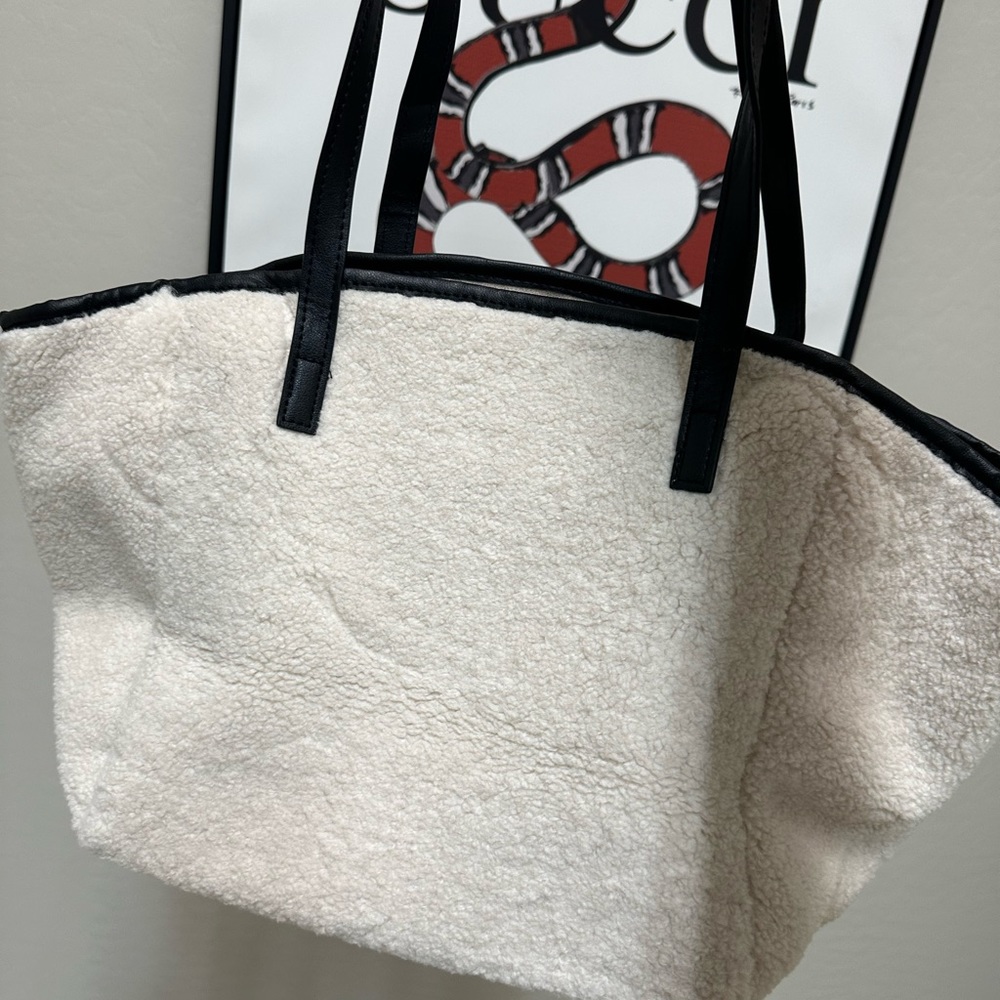 Tote Bag in cream ;Neiman Marcus
Faux Shearling Tote with makeup bag - Picture 3 of 9